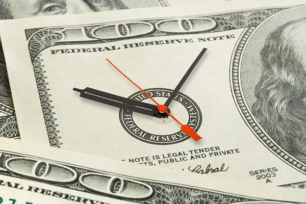 clock on a 100 dollar bill