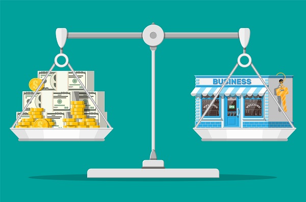 Scales with commercial property with key and money